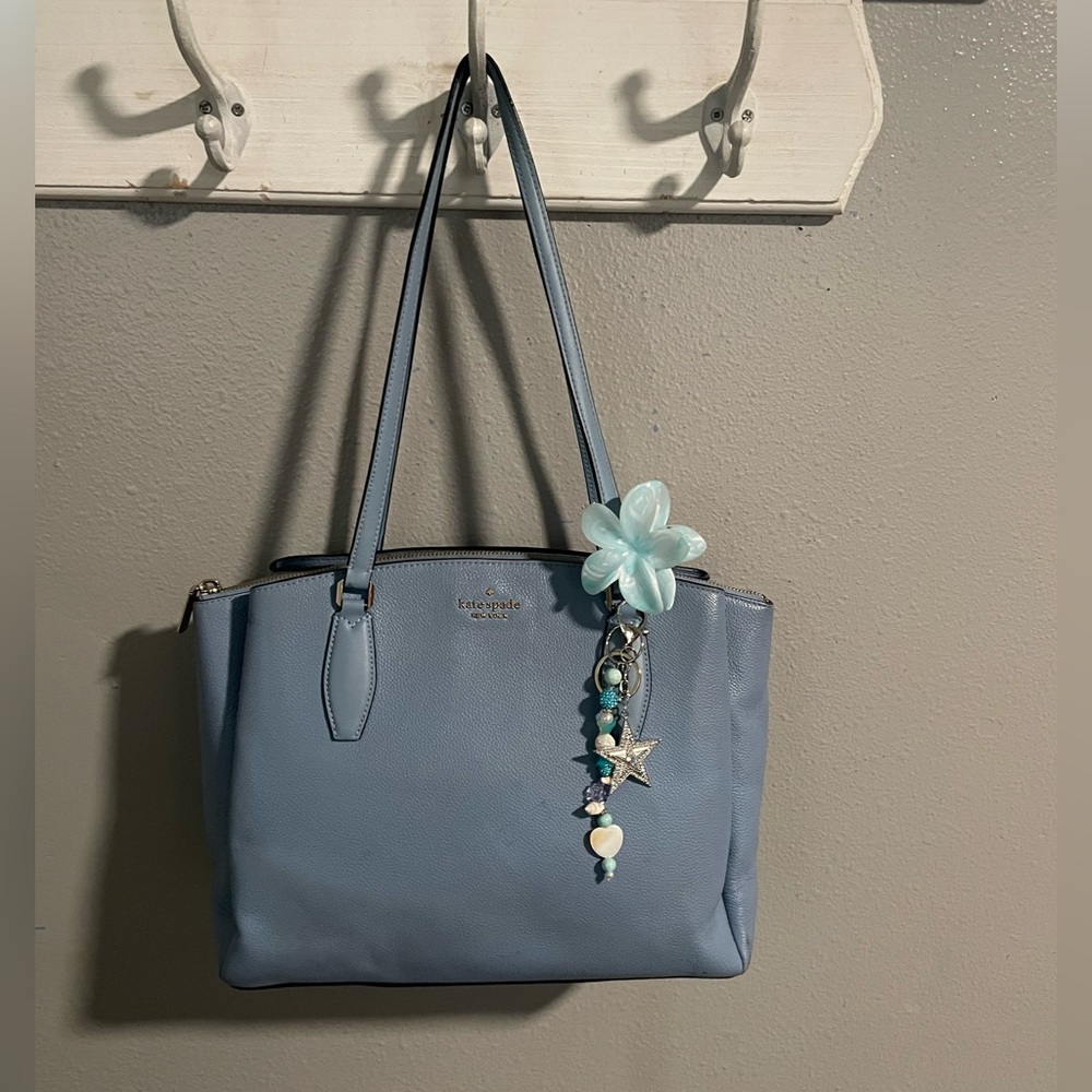 Elegant Blue Handbag with Charm